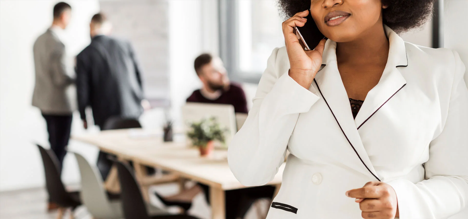 A professional taking a telephone call in an office